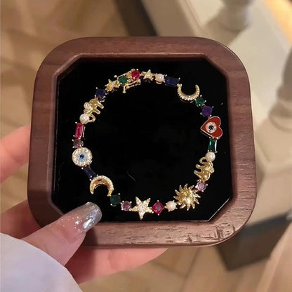 💐🔥Køb 2, få 1 gratis💫Fantastisk armbånd med himmelske charms✨(Gratis opbevaringsæske)